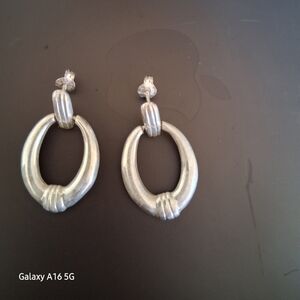 Silver plate oval drop earrings.